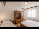 Apartments and rooms Vedra- free parking and close to the beach A1 (2+1), SA2 - B(2+1), C3 (2), D4 (2+1), E5 (2+1) Baska Voda - Riviera Makarska  - Apartment - D4 (2+1): bedroom