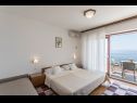 Apartments and rooms Vedra- free parking and close to the beach A1 (2+1), SA2 - B(2+1), C3 (2), D4 (2+1), E5 (2+1) Baska Voda - Riviera Makarska  - Apartment - A1 (2+1): bedroom