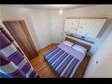 Apartments and rooms Mit - 100m to the sea: A1(4) Crveni, SA2(2) Zeleni, A3(4) Zuti, A4(2+2) Purple, A5(4+2) b&w, R1(2) Biograd - Riviera Biograd  - Apartment - A4(2+2) Purple: bedroom