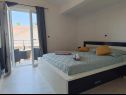 Apartments and rooms Mit - 100m to the sea: A1(4) Crveni, SA2(2) Zeleni, A3(4) Zuti, A4(2+2) Purple, A5(4+2) b&w, R1(2) Biograd - Riviera Biograd  - Apartment - A5(4+2) b&w: bedroom