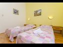 Apartments Ljuba - nice garden: A2(4+1) Plavi, A3(4+1) Ljubicasti, A4(8+1) Okrug Gornji - Island Ciovo  - Apartment - A3(4+1) Ljubicasti: bedroom