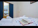 Apartments Ljuba - nice garden: A2(4+1) Plavi, A3(4+1) Ljubicasti, A4(8+1) Okrug Gornji - Island Ciovo  - Apartment - A2(4+1) Plavi: bedroom
