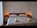Apartments and rooms Ljuba - 130 meter from sea SA1(2), SA2(2), SA6(2), A4(2+1), R3(2+1), R7(2+1) Makarska - Riviera Makarska  - Apartment - A4(2+1): bedroom