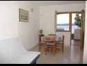 Apartments Niko - 50 m from pebble beach: SA1(2+1), SA2(2+1), SA3(2+1), A4(3+1), A5 Prizemlje(3+1), A6 Prvi kat(3+1) Pisak - Riviera Omis  - Apartment - A5 Prizemlje(3+1): dining room