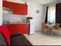Apartments Marin - 100 m from beach: A1 blue(2+1), A2 red(2+1), A3 green(2+1), A4 orange(2+1), A5 silver(2+1) Pirovac - Riviera Sibenik  - Apartment - A2 red(2+1): kitchen and dining room