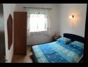 Apartments Maja - 80 m from pebble beach: A1(4+1) prizemlje, A4(4) kat, SA1 Istok(2), SA2 Zapad(2) Vinisce - Riviera Trogir  - Apartment - A1(4+1) prizemlje: bedroom